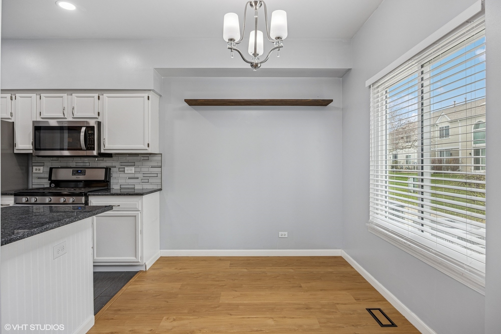 1601 Spaulding Road Bartlett, IL 60103 - Photo 5 of 15 a kitchen with stainless steel appliances a microwave a stove and white cabinets