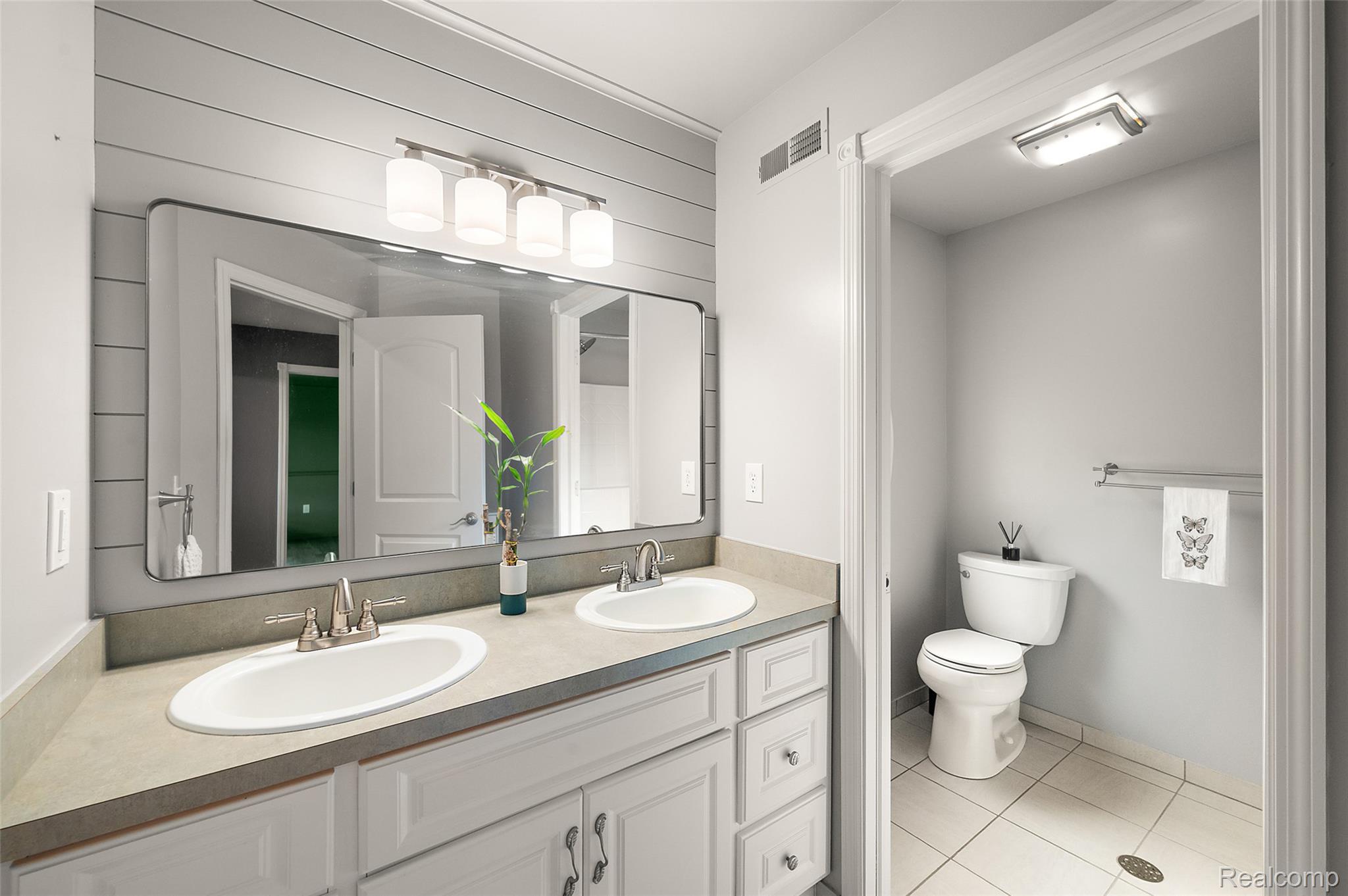 5035 Hidden Ridge Road Metamora, MI 48455 - Photo 41 of 65 Dual vanity with integrated sinks and brushed nickel faucets