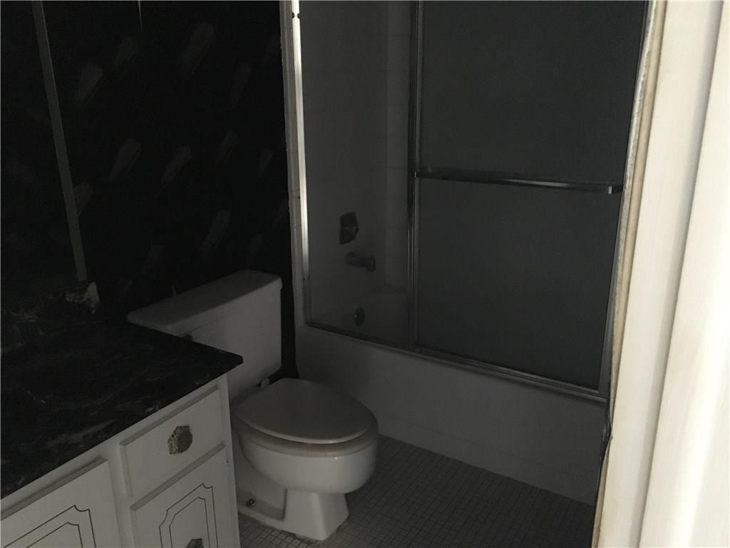 3601 Inverrary Drive, Unit 402 Lauderhill, FL 33319 - Photo 13 of 14 a bathroom with a toilet and a shower