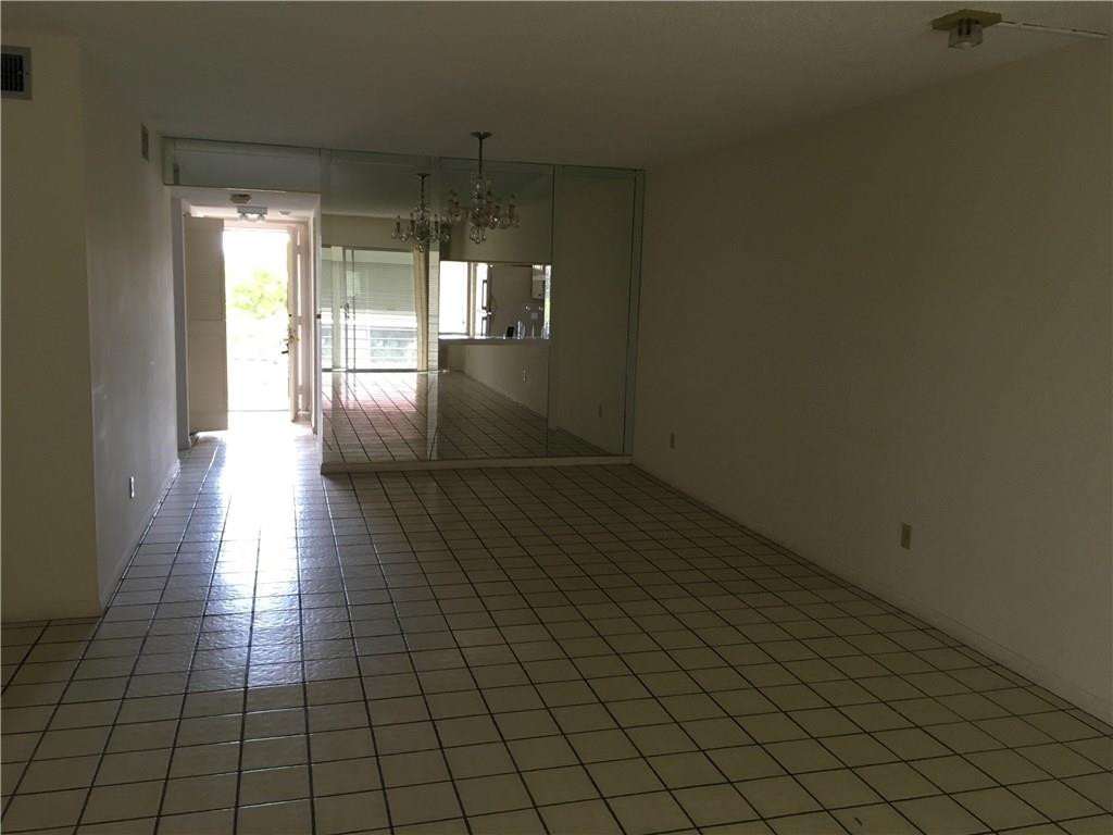 3601 Inverrary Drive, Unit 402 Lauderhill, FL 33319 - Photo 14 of 14 a view of a hallway with wooden floor