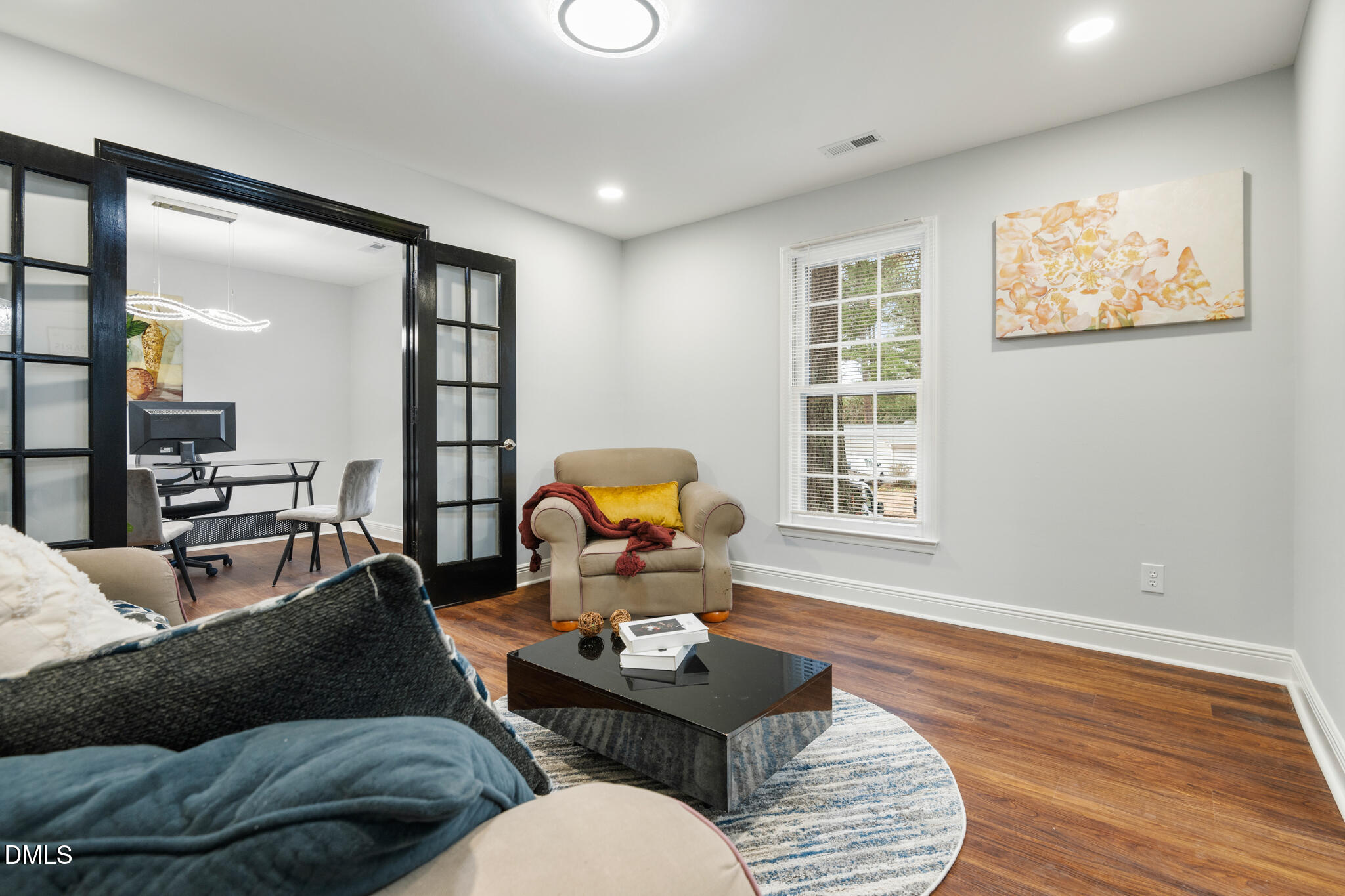 6604 Winding Trail Raleigh, NC 27612 - Photo 11 of 49 a living room with furniture and wooden floor