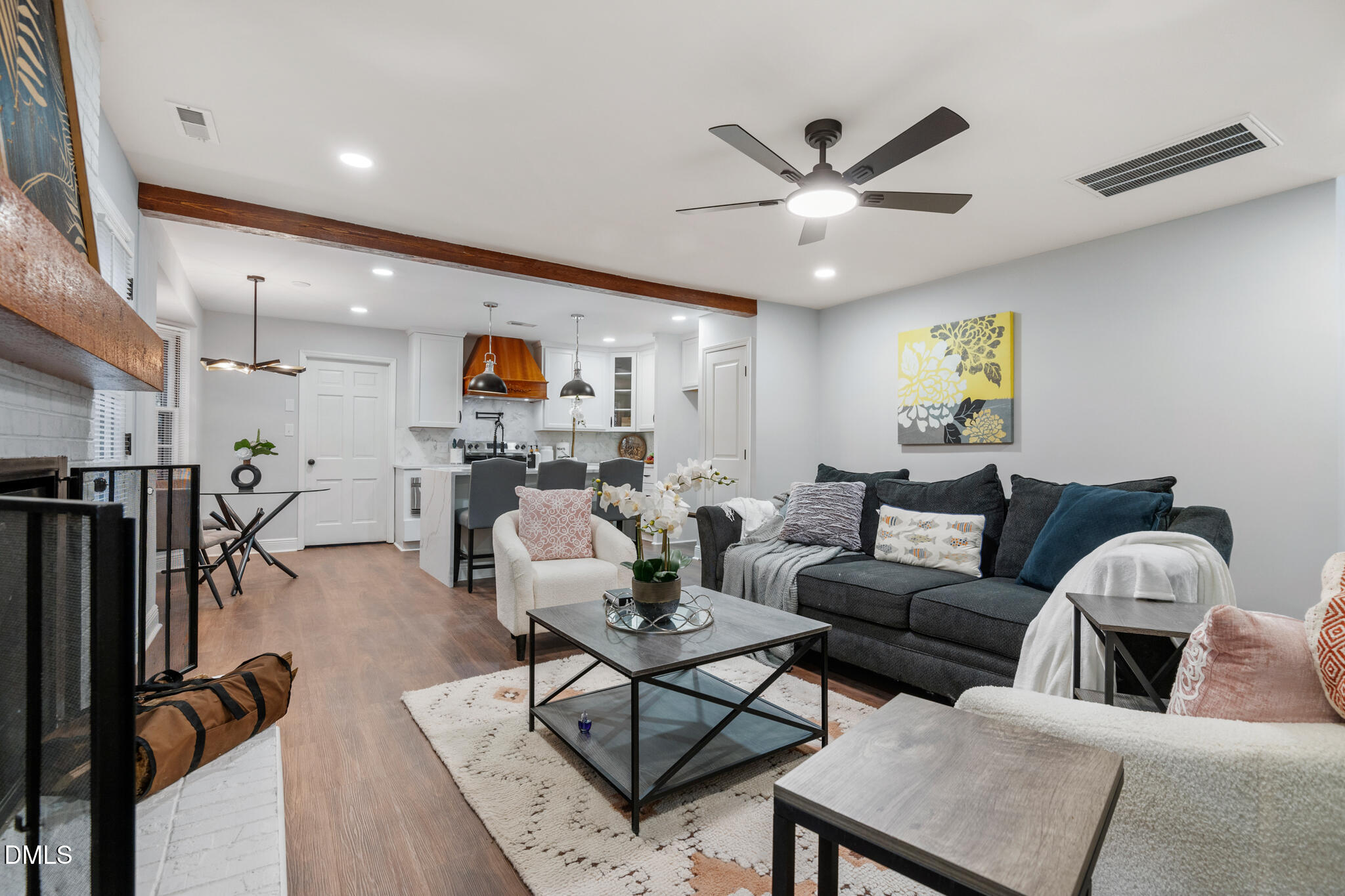 6604 Winding Trail Raleigh, NC 27612 - Photo 14 of 49 a living room with furniture and kitchen view