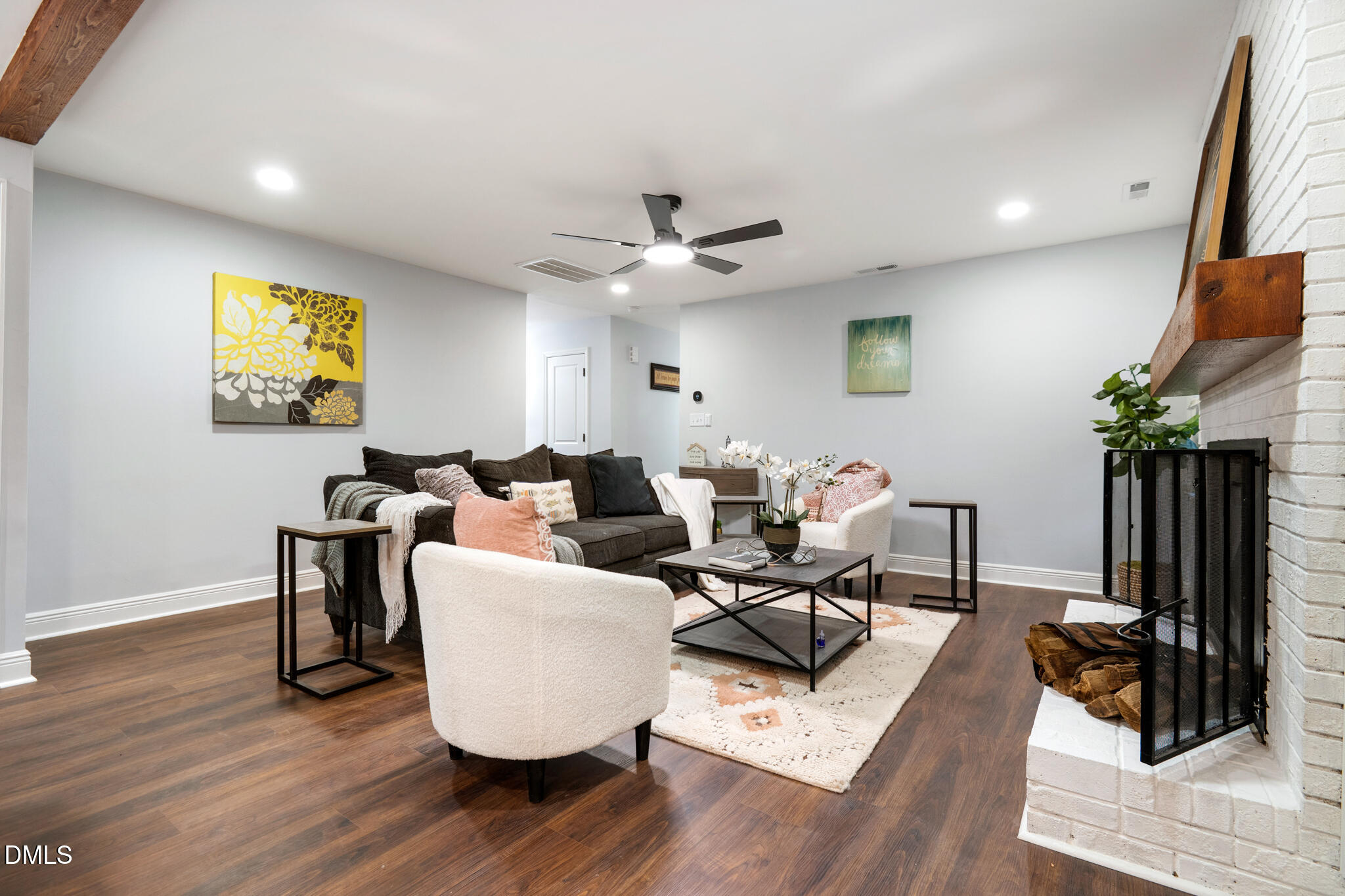 6604 Winding Trail Raleigh, NC 27612 - Photo 16 of 49 a living room with fireplace furniture and a wooden floor