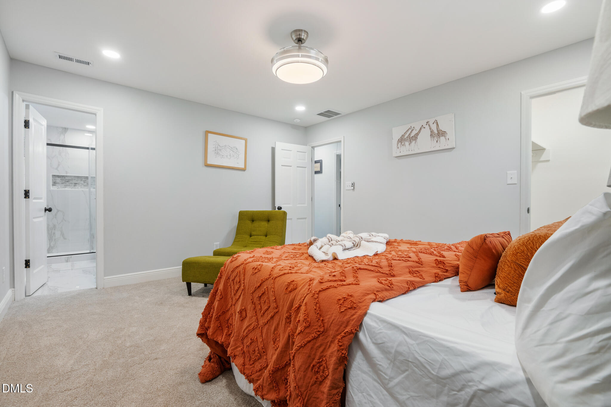 6604 Winding Trail Raleigh, NC 27612 - Photo 28 of 49 a bedroom with a bed and a chandelier