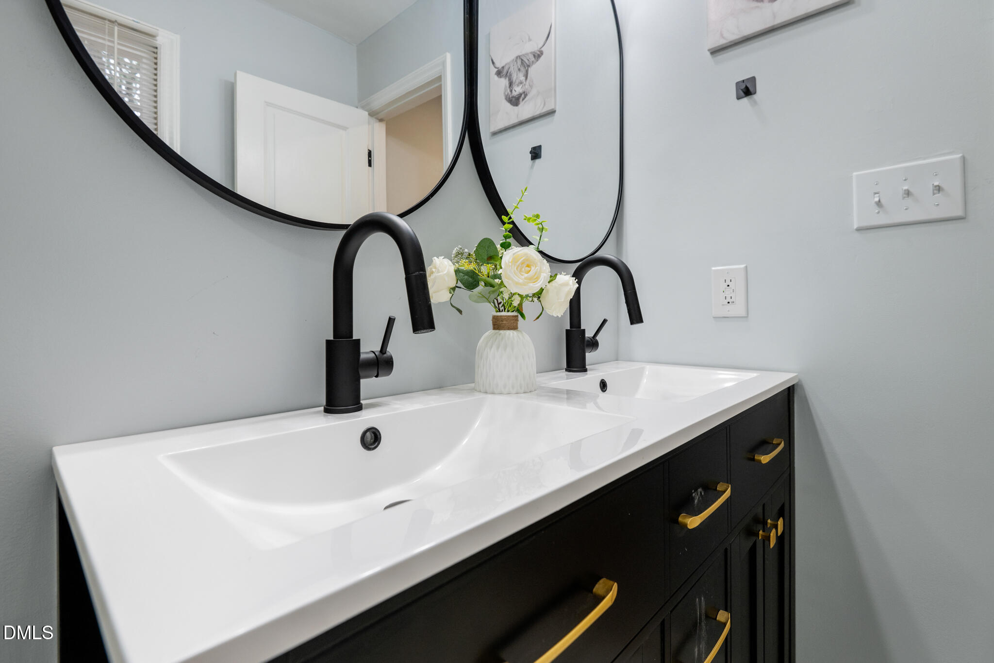 6604 Winding Trail Raleigh, NC 27612 - Photo 31 of 49 a bathroom with a sink and a mirror