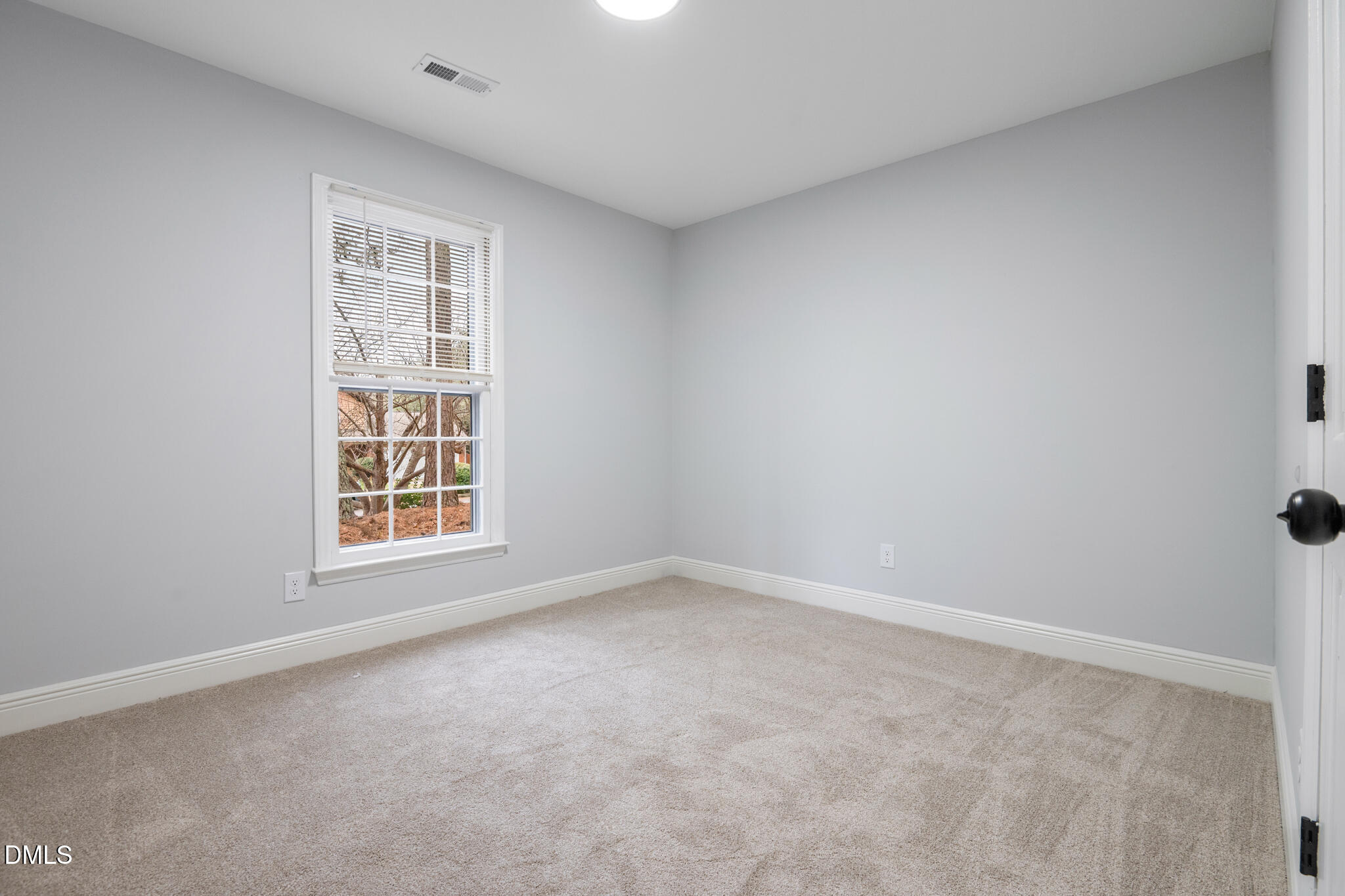 6604 Winding Trail Raleigh, NC 27612 - Photo 34 of 49 an empty room with a window