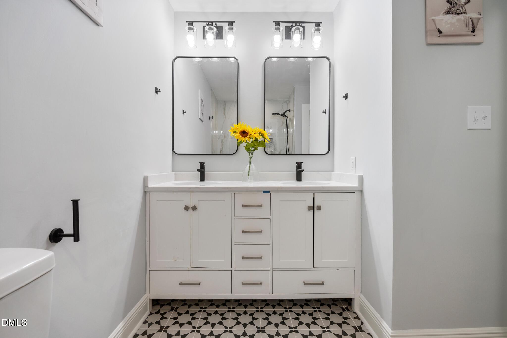 6604 Winding Trail Raleigh, NC 27612 - Photo 35 of 49 a bathroom with a sink a toilet and mirror