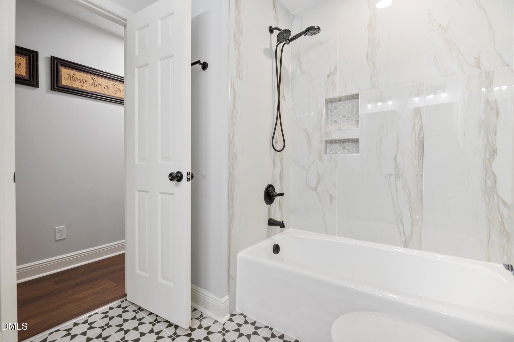 6604 Winding Trail Raleigh, NC 27612 - Photo 36 of 49 a bathroom with a bath tub and shower
