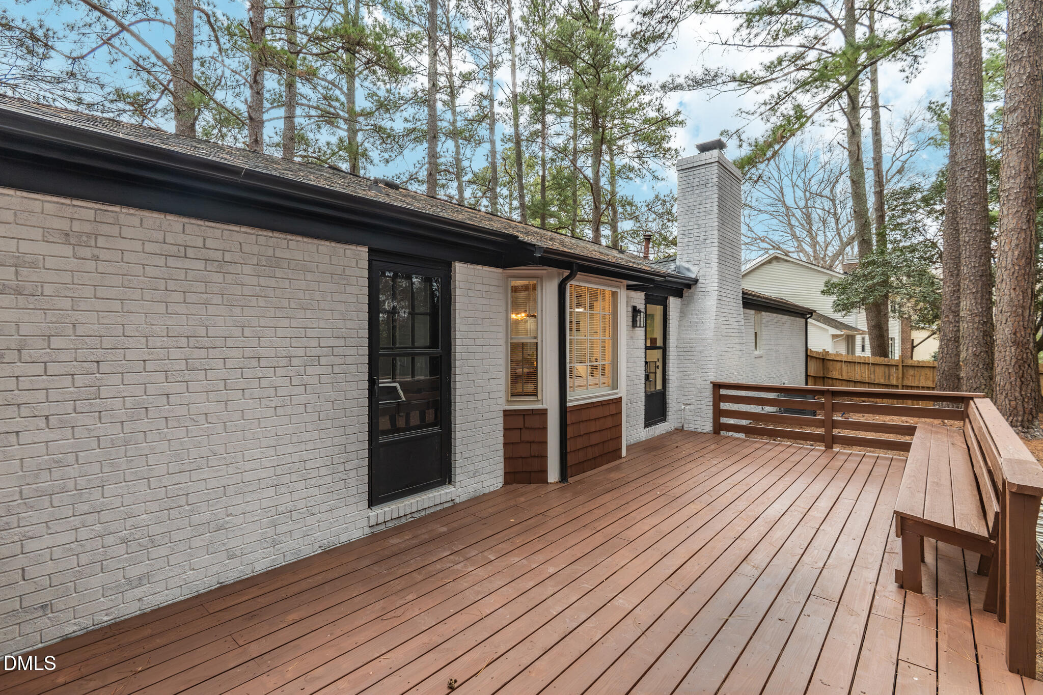 6604 Winding Trail Raleigh, NC 27612 - Photo 41 of 49 a view of front door deck and wooden floor