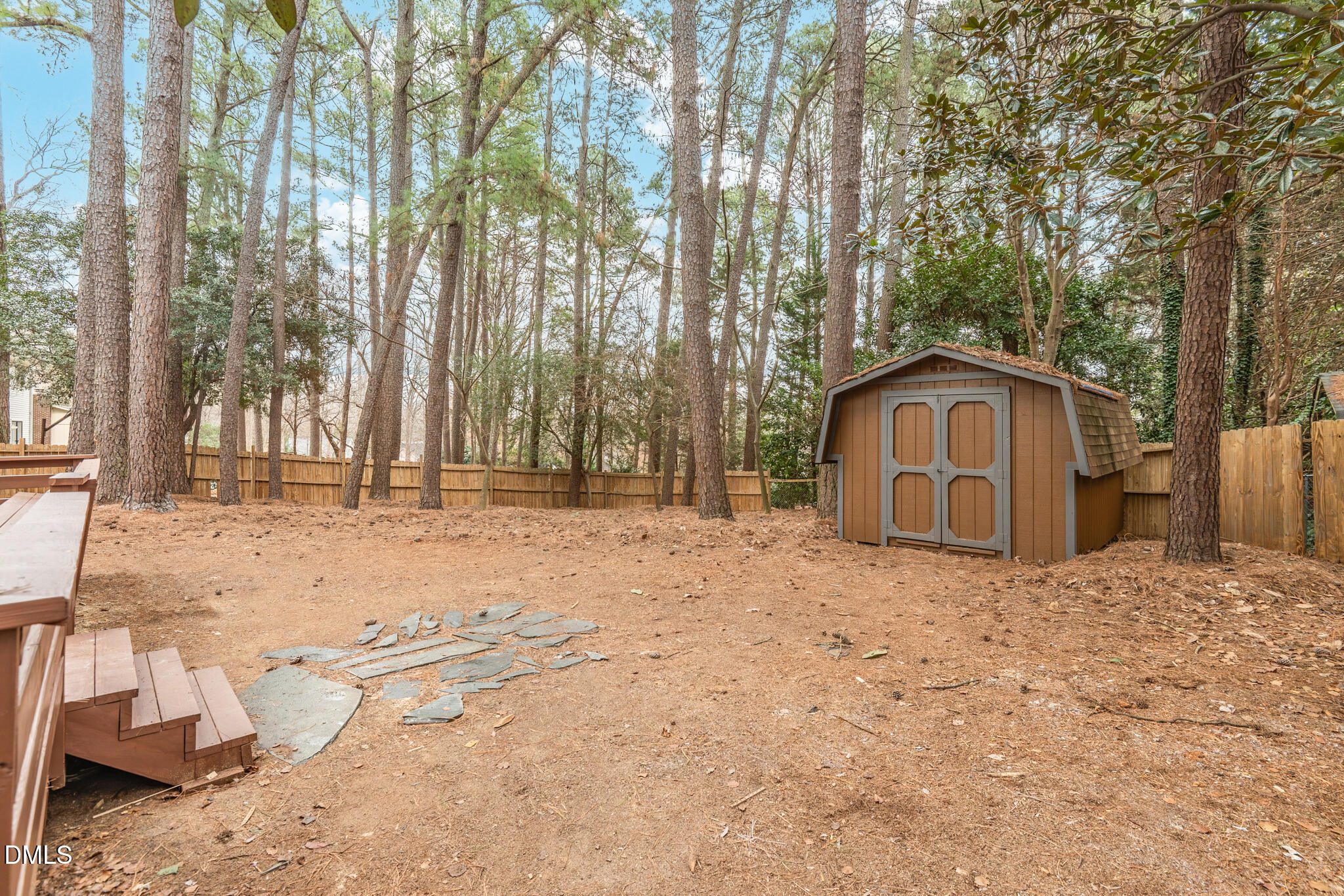 6604 Winding Trail Raleigh, NC 27612 - Photo 42 of 49 a view of garage yard and tree