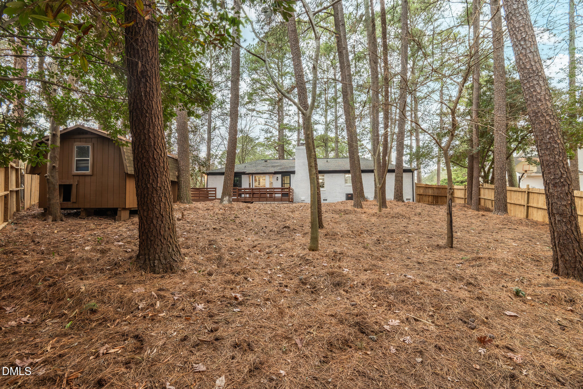 6604 Winding Trail Raleigh, NC 27612 - Photo 44 of 49 a backyard of a house with lots of green space