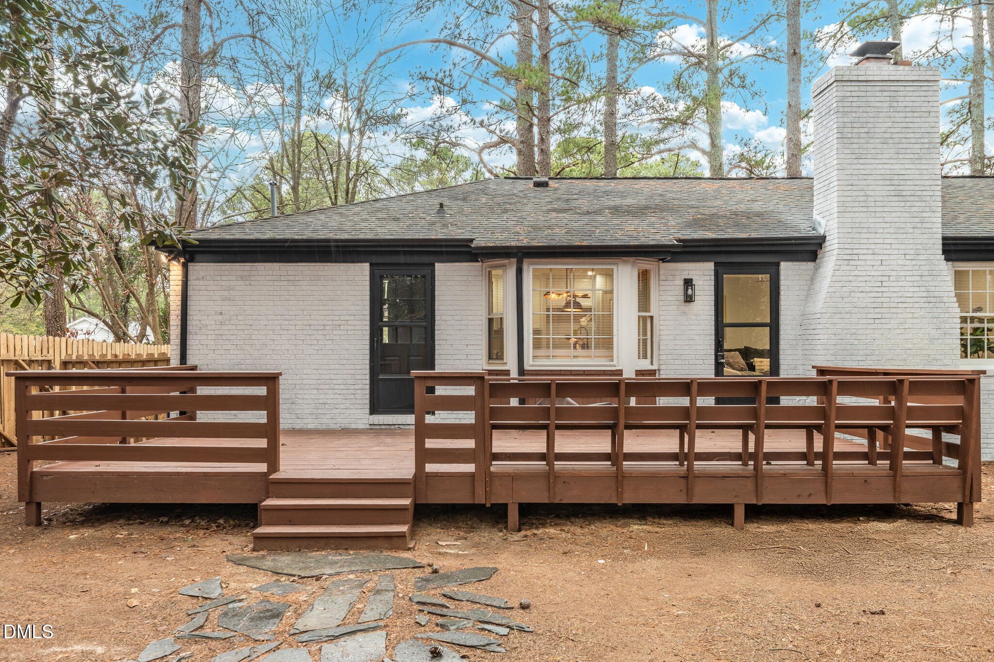 6604 Winding Trail Raleigh, NC 27612 - Photo 47 of 49 a view of a house with a wooden fence
