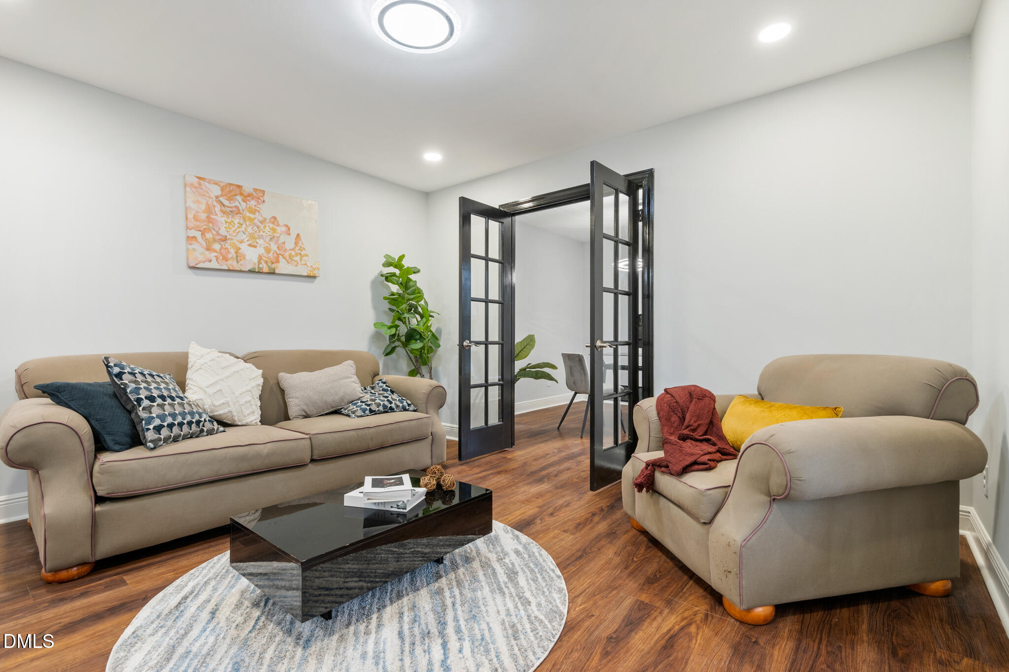 6604 Winding Trail Raleigh, NC 27612 - Photo 7 of 49 a living room with furniture and wooden floor