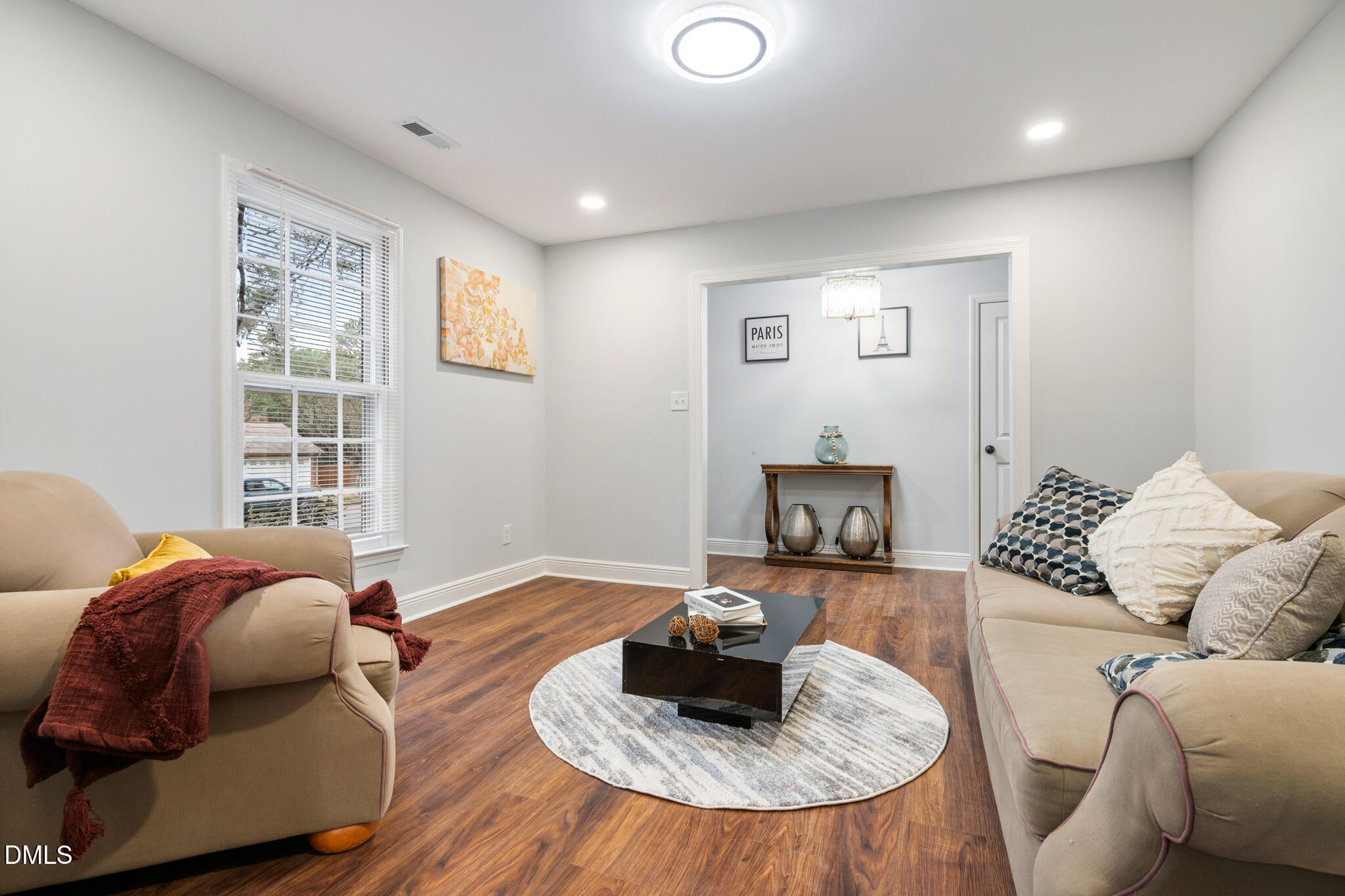 6604 Winding Trail Raleigh, NC 27612 - Photo 8 of 49 a living room with furniture and a large window