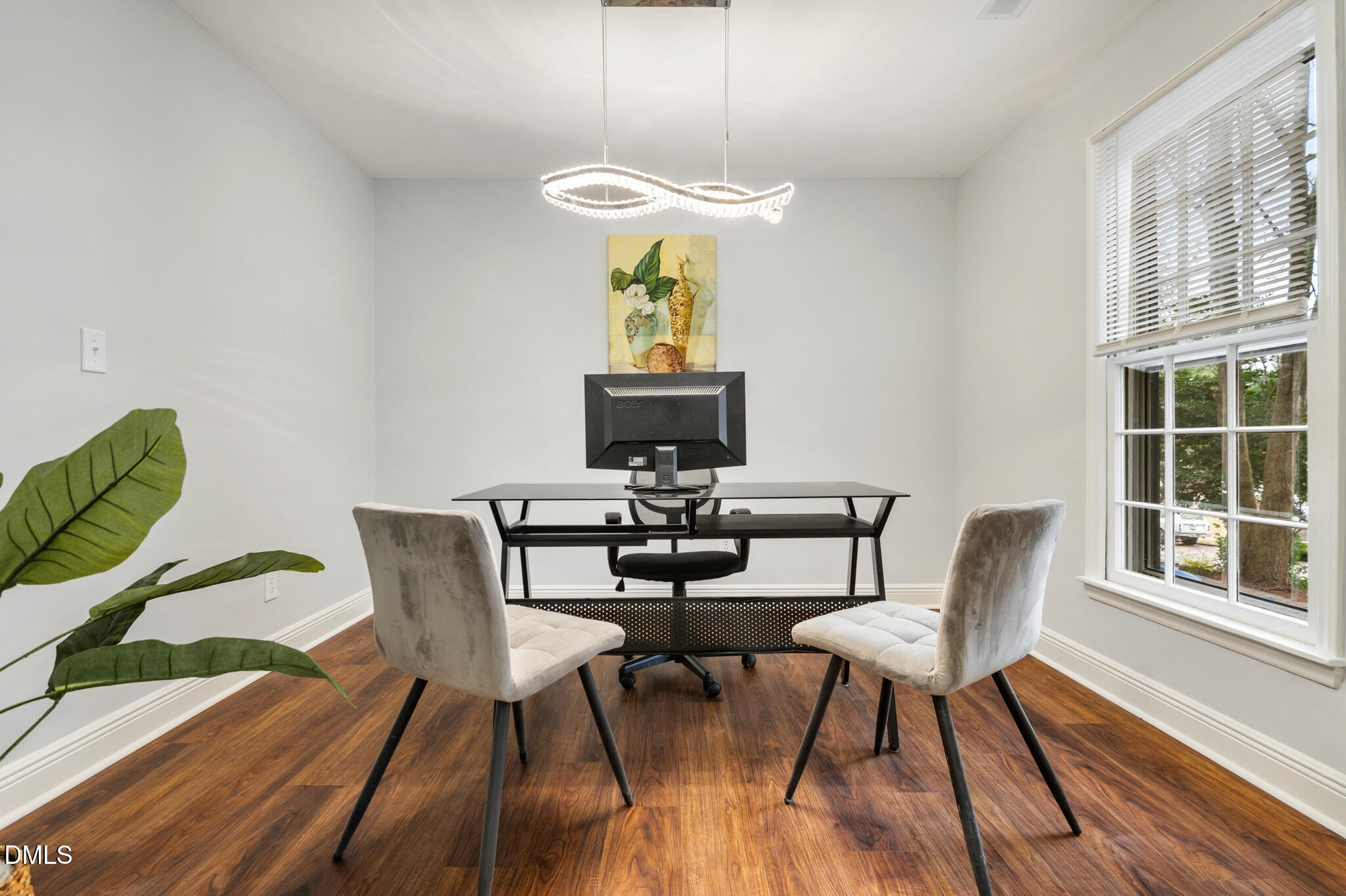 6604 Winding Trail Raleigh, NC 27612 - Photo 9 of 49 a view of a dining room with furniture wooden floor and chandelier