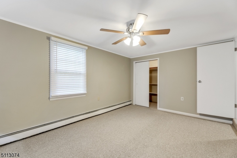 2 Center Street Madison, NJ 07940 - Photo 13 of 18 an empty room with windows and fan