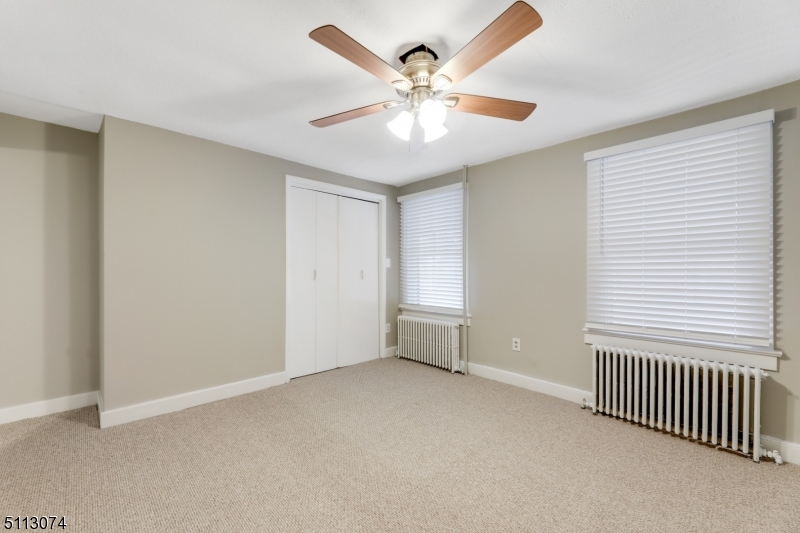 2 Center Street Madison, NJ 07940 - Photo 14 of 18 an empty room with windows and fan