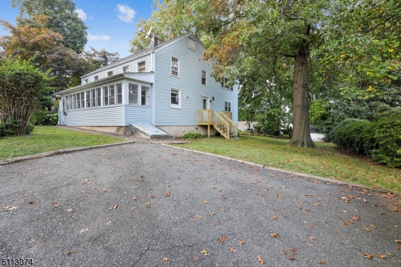 2 Center Street Madison, NJ 07940 - Photo 17 of 18 a view of a house with backyard and trees