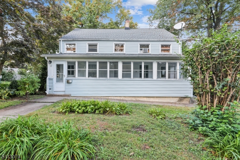 2 Center Street Madison, NJ 07940 - Photo 18 of 18 a house with trees in the background