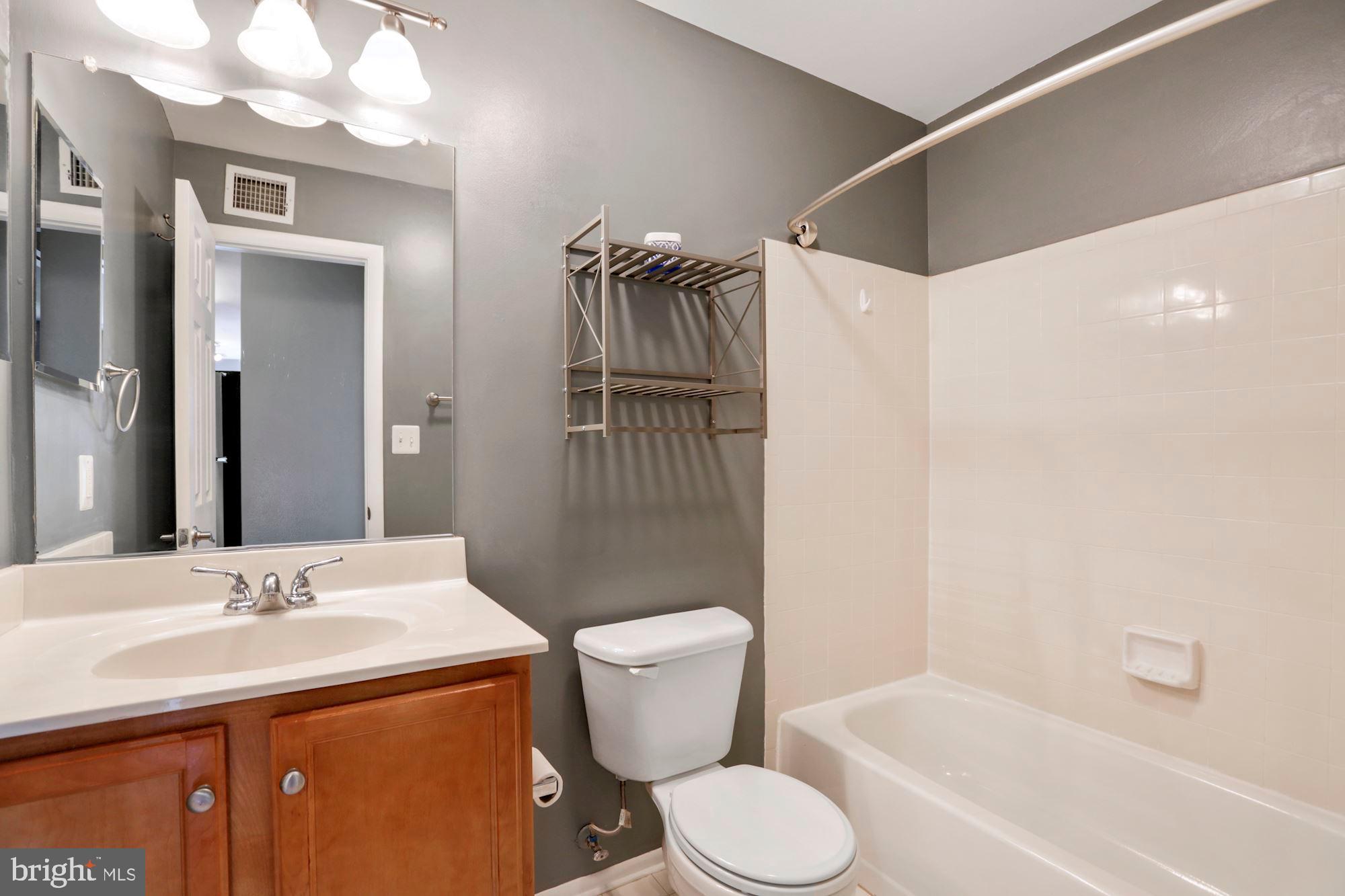11659 Chesterfield Court, Unit D Reston, VA 20190 - Photo 14 of 28 Bathroom with shower and tub combination
