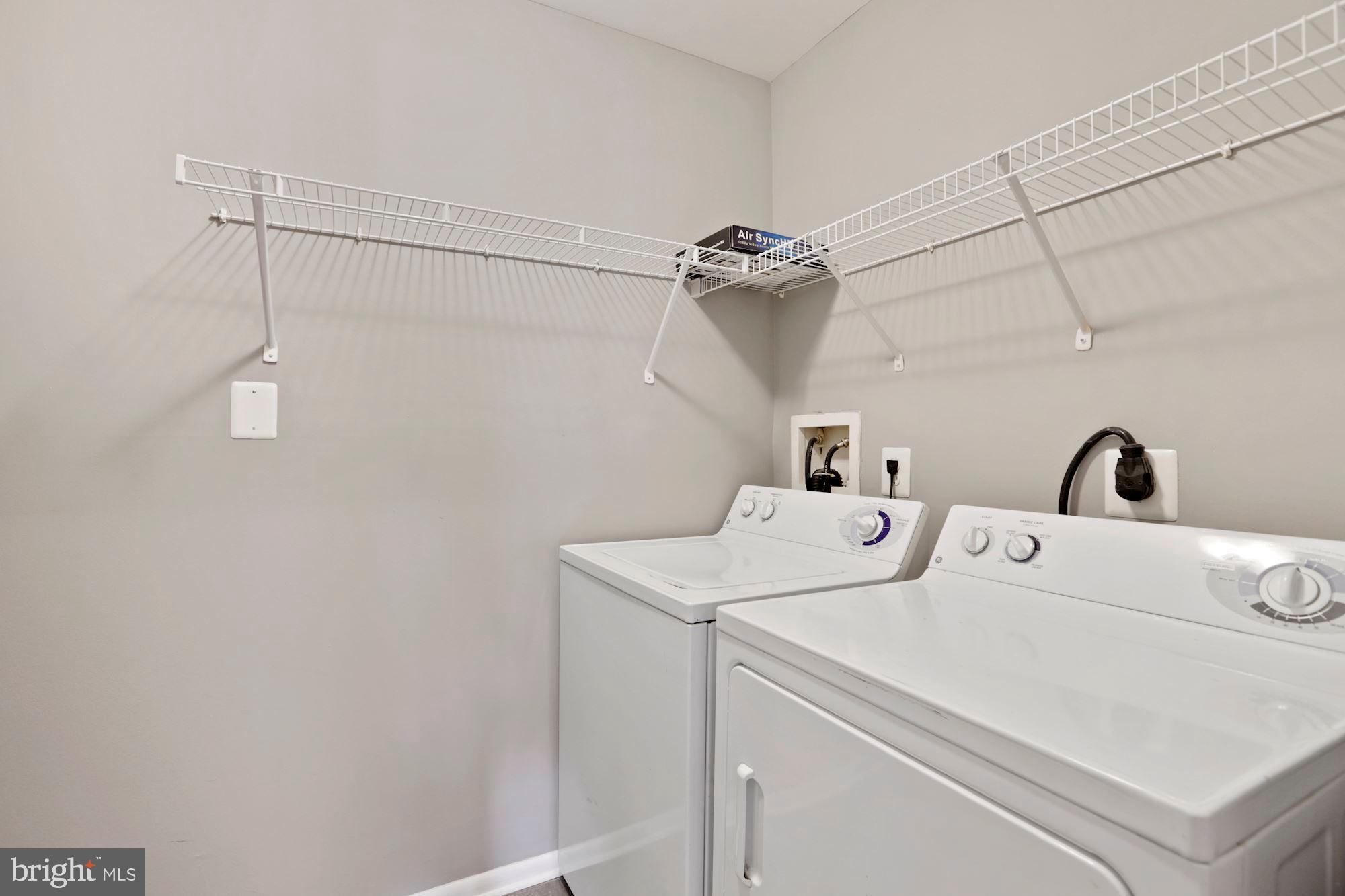 11659 Chesterfield Court, Unit D Reston, VA 20190 - Photo 18 of 28 Full sized washer and dryer with optimal storage.