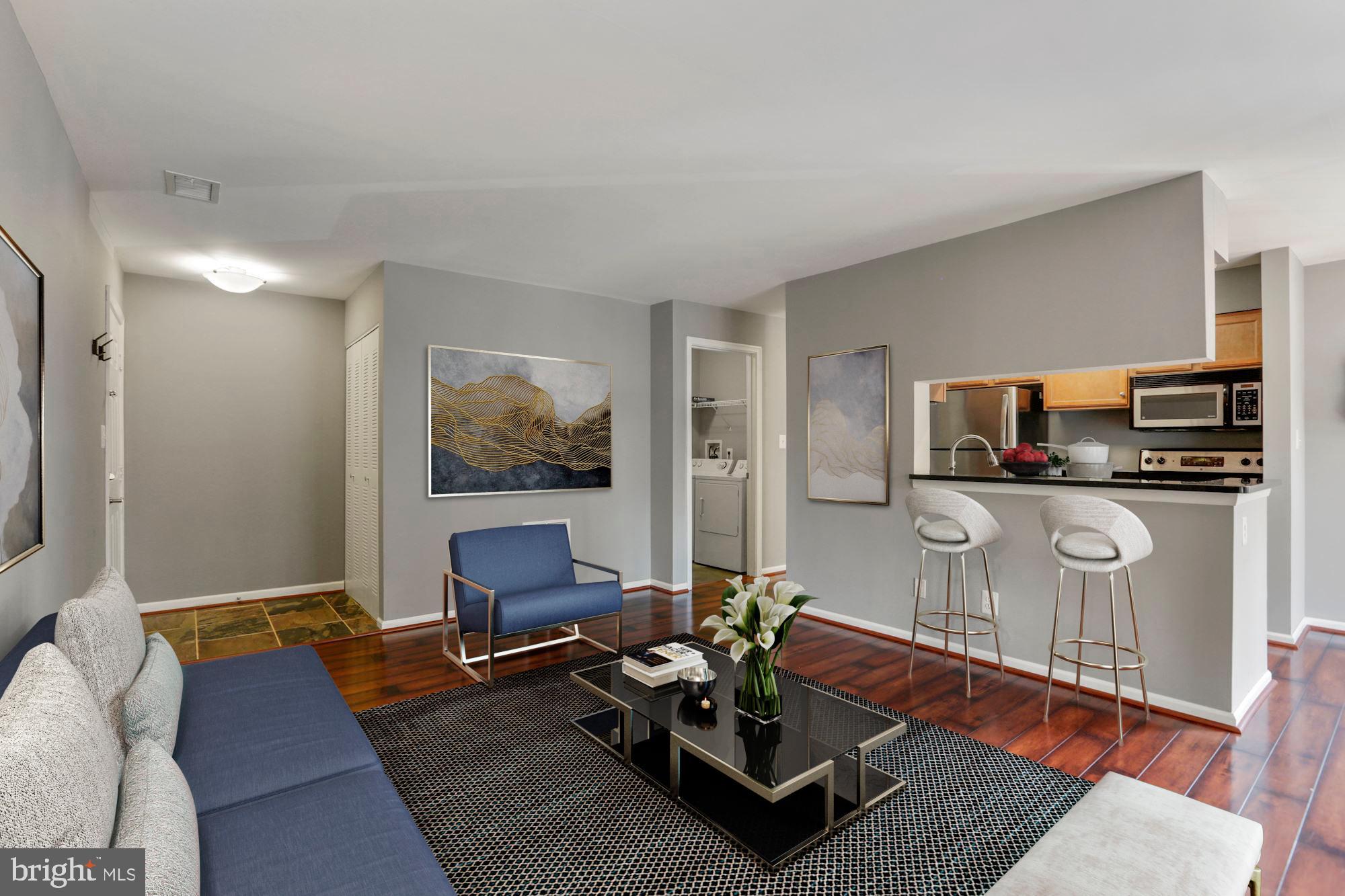 Living room with bar seating into kitchen