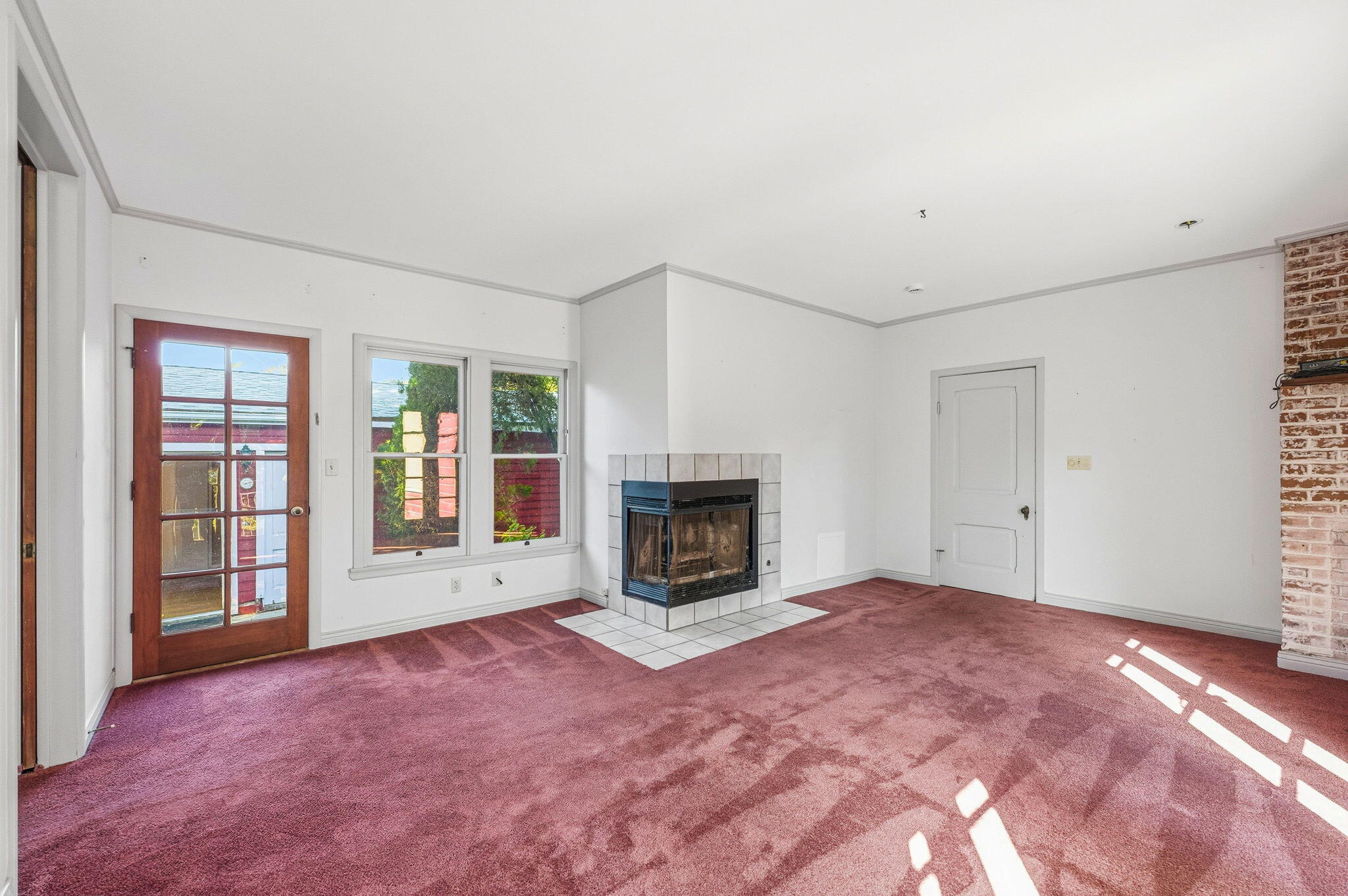 1225 Say Road Santa Paula, CA 93060 - Photo 18 of 45 a view of an empty room with a fireplace and a window