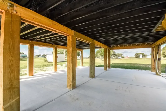 a view of an empty room with a large window