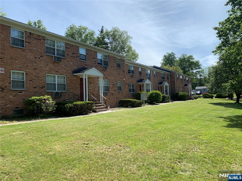 153 Park Avenue, Unit 153C Park Ridge, NJ 07656 - Photo 21 of 21 a front view of a house with a yard