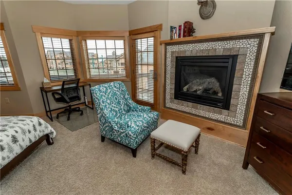 a bathroom with a double vanity sink mirror and bathtub