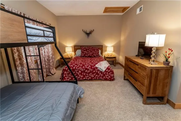 a bathroom with a double vanity sink toilet and shower