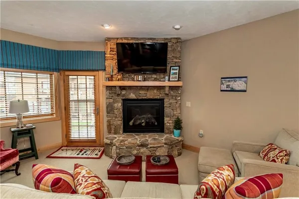 a living room with furniture a dining table and chairs