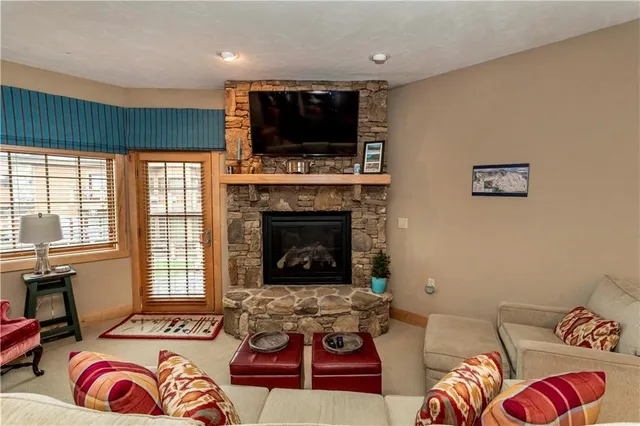 a living room with furniture a dining table and chairs
