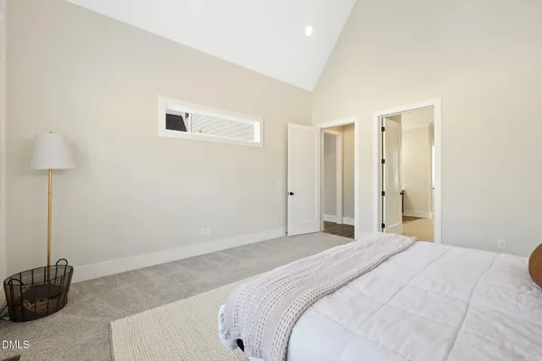 a spacious bathroom with a granite countertop sink mirror and shower