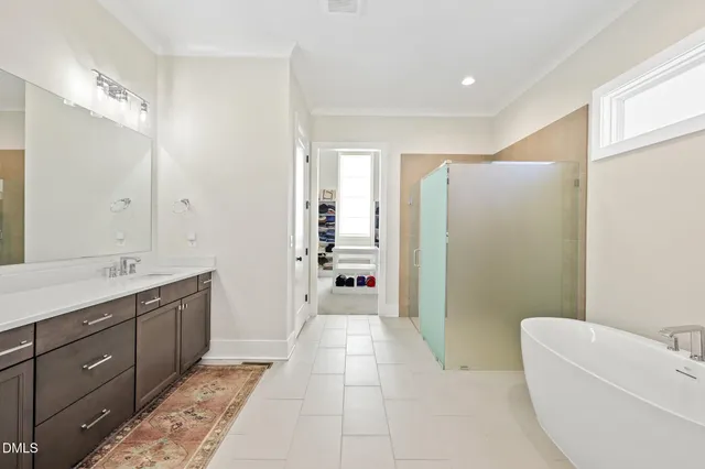 a view of an empty room with cabinet and entryway