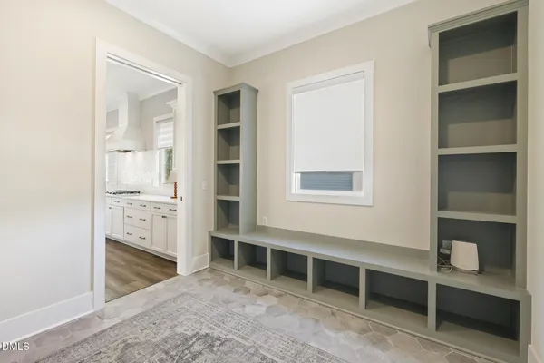 a bedroom with a bed furniture and a window