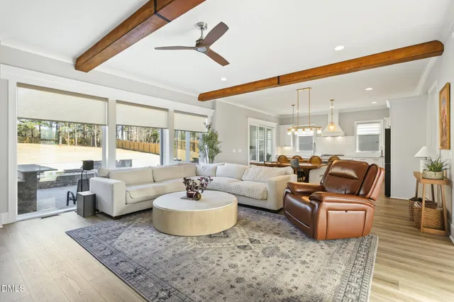 a large kitchen with stainless steel appliances kitchen island granite countertop a sink and cabinets