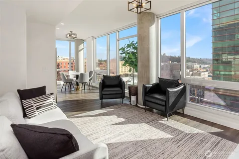 a living room with furniture and a large window