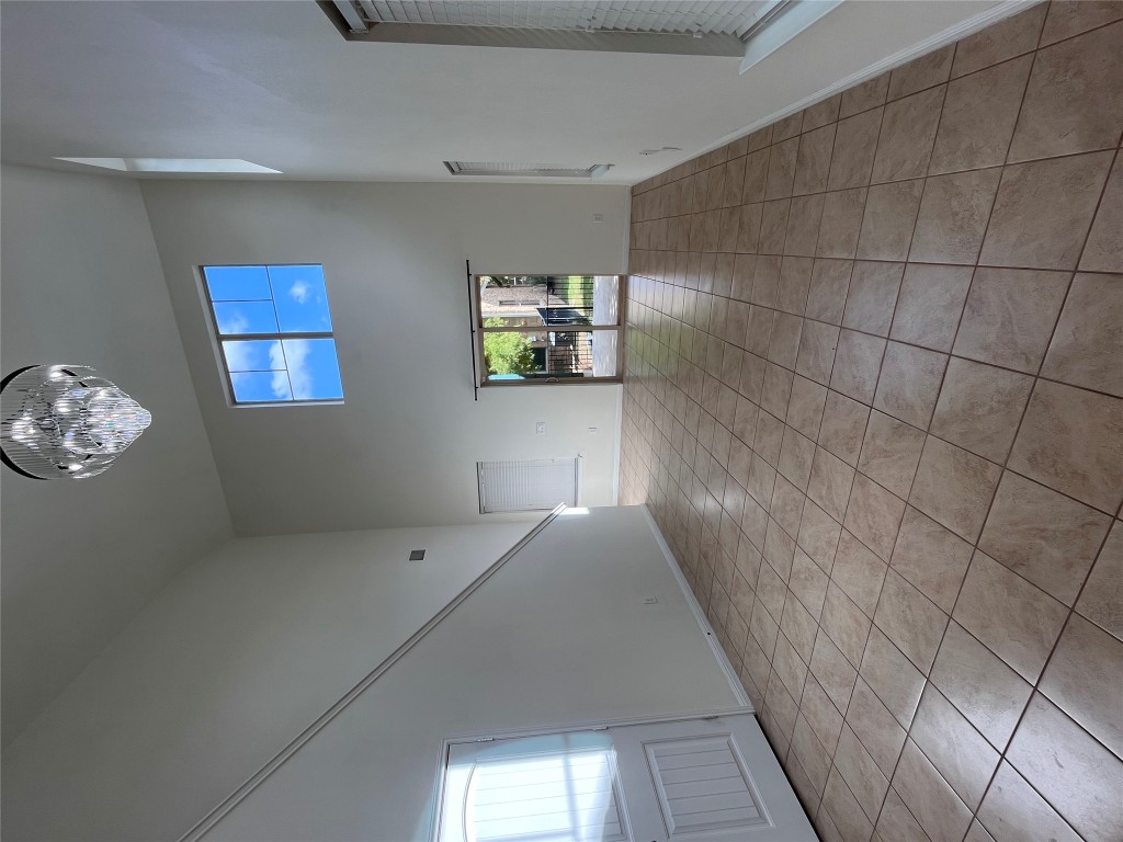 516 East Slaughter Lane, Unit 1404 Austin, TX 78744 - Photo 1 of 17 a view of an empty room and a window