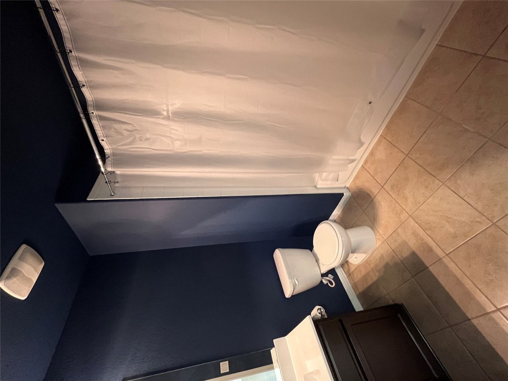 516 East Slaughter Lane, Unit 1404 Austin, TX 78744 - Photo 11 of 17 a bathroom with a sink and a toilet