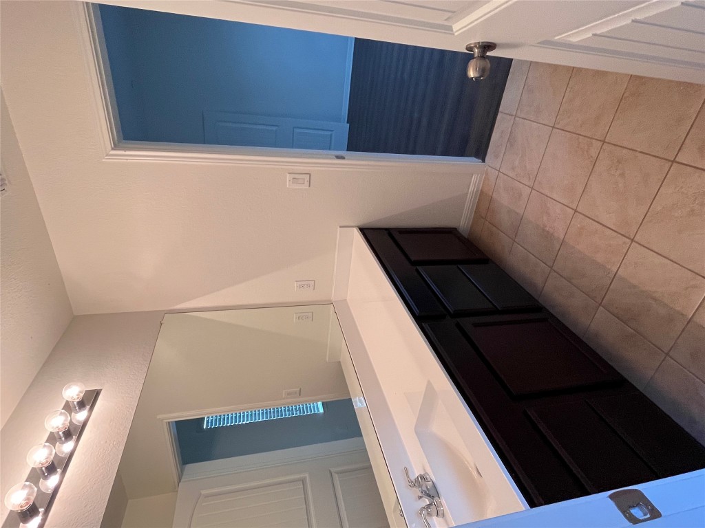 516 East Slaughter Lane, Unit 1404 Austin, TX 78744 - Photo 13 of 17 a bathroom with a sink and a mirror