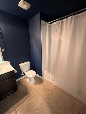 a large bathroom with a double vanity sink and a mirror