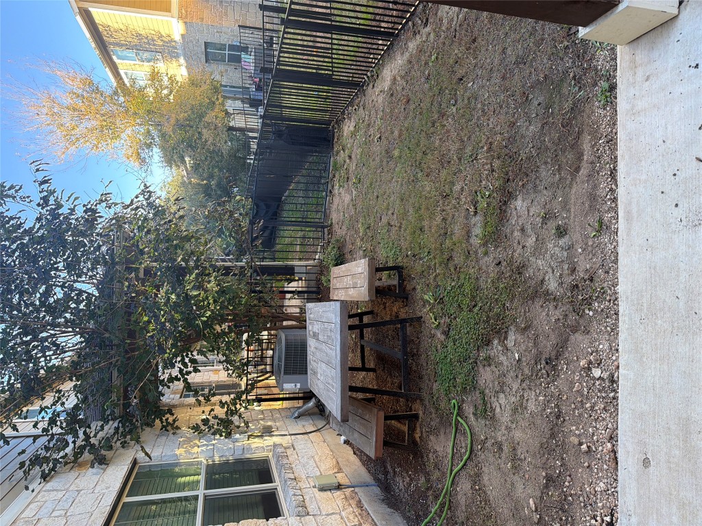 516 East Slaughter Lane, Unit 1404 Austin, TX 78744 - Photo 16 of 17 a view of a house with backyard and sitting area