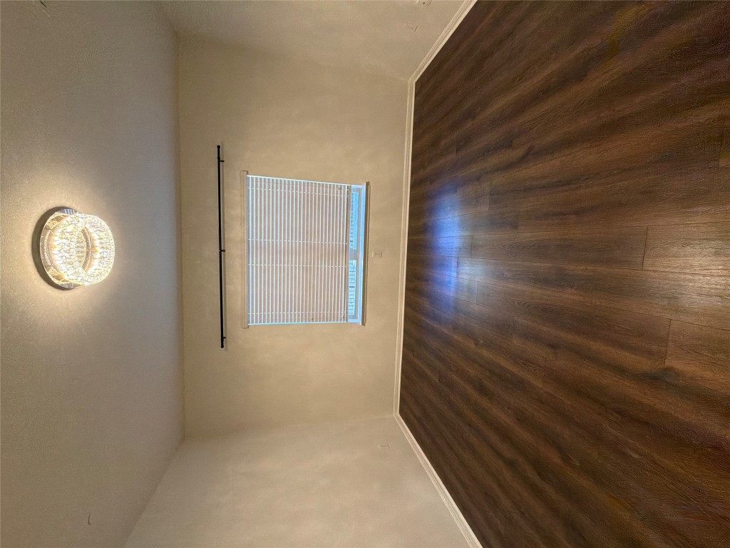 516 East Slaughter Lane, Unit 1404 Austin, TX 78744 - Photo 4 of 17 an empty room with wooden floor and windows