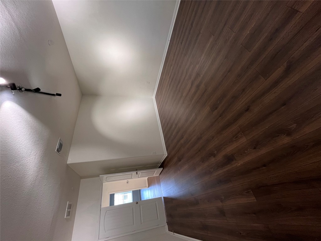 516 East Slaughter Lane, Unit 1404 Austin, TX 78744 - Photo 9 of 17 a view of an empty room with wooden floor