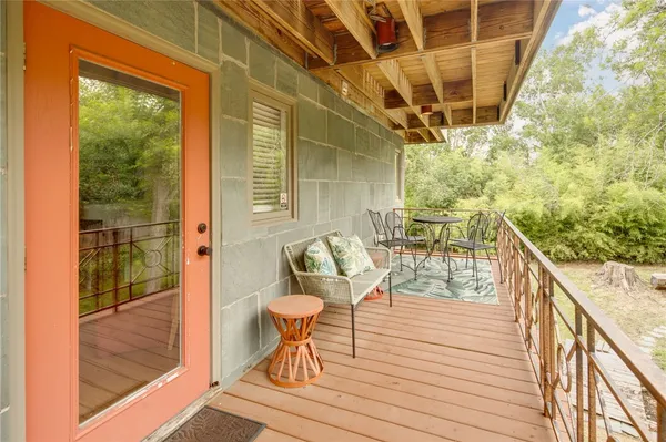 a balcony view with a seating space