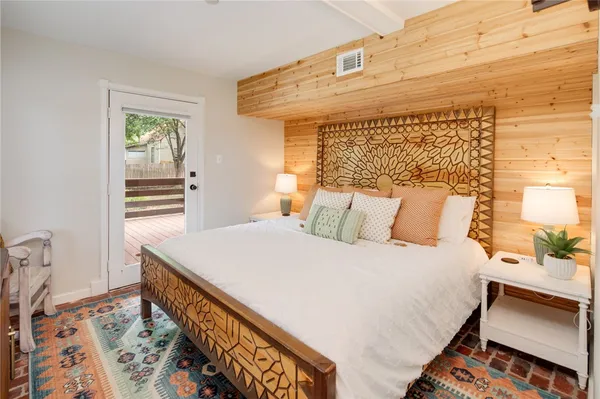 a bedroom with a bed and a dresser