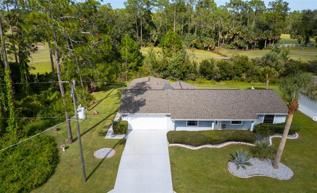 22 Westfield Lane Palm Coast, FL 32164 - Photo 13 of 47 an aerial view of a house with yard swimming pool and outdoor seating