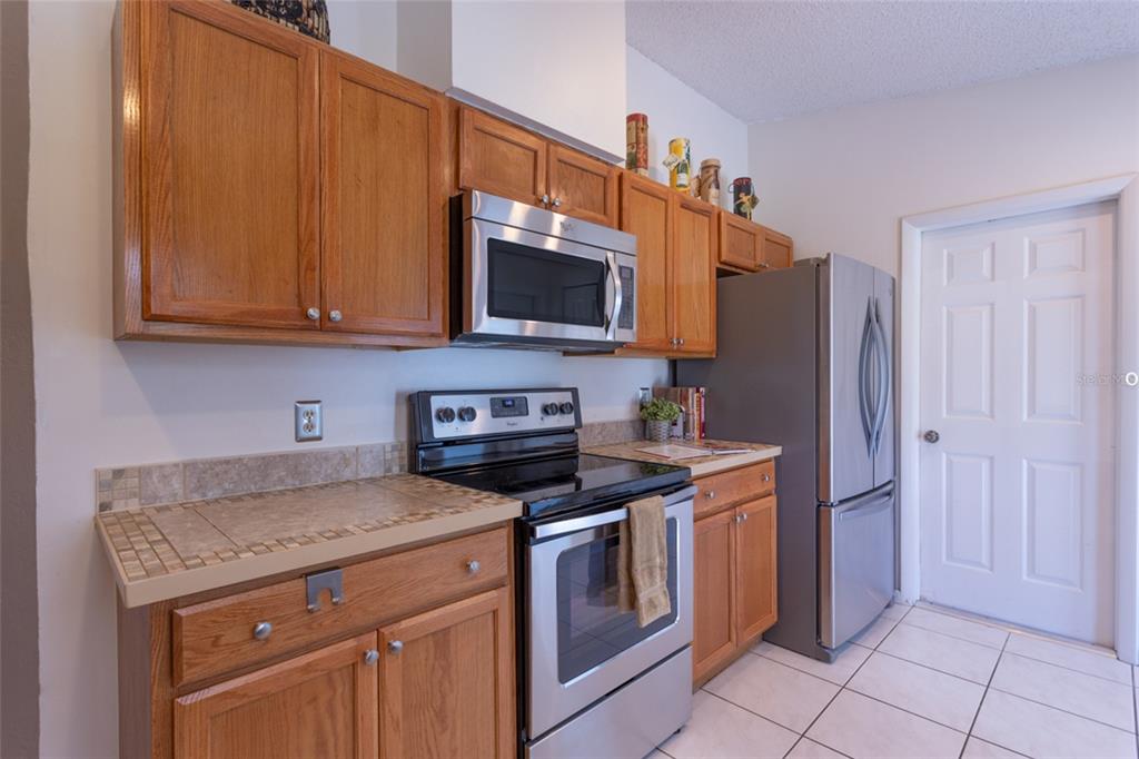 22 Westfield Lane Palm Coast, FL 32164 - Photo 15 of 47 a kitchen with a stove and a microwave