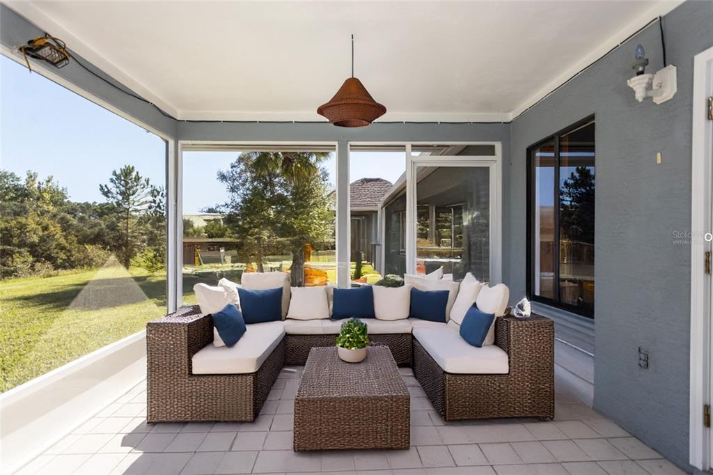 22 Westfield Lane Palm Coast, FL 32164 - Photo 21 of 47 a outdoor living space with furniture and garden view